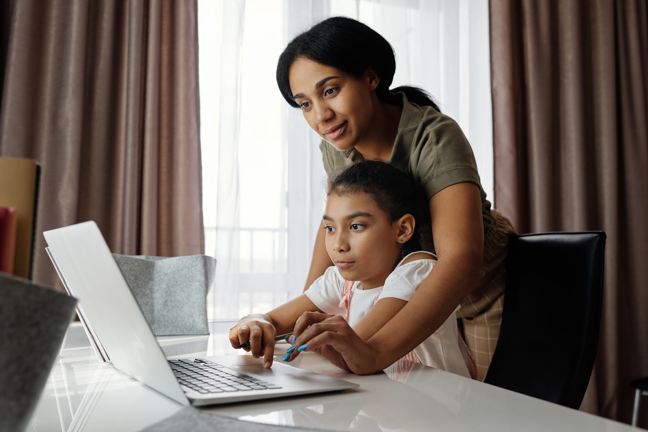 mother and daughter on computer