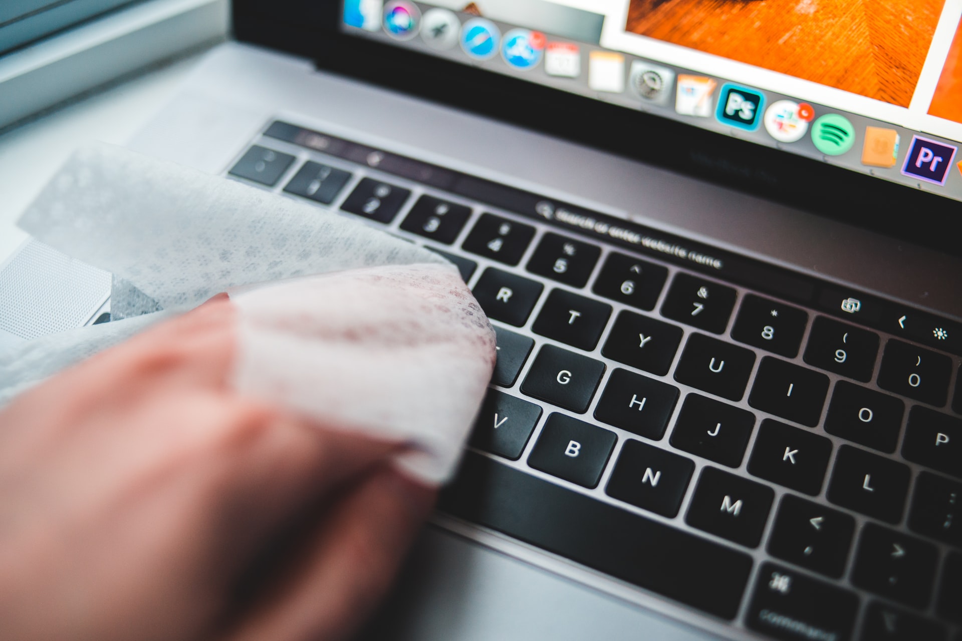 wiping down laptop