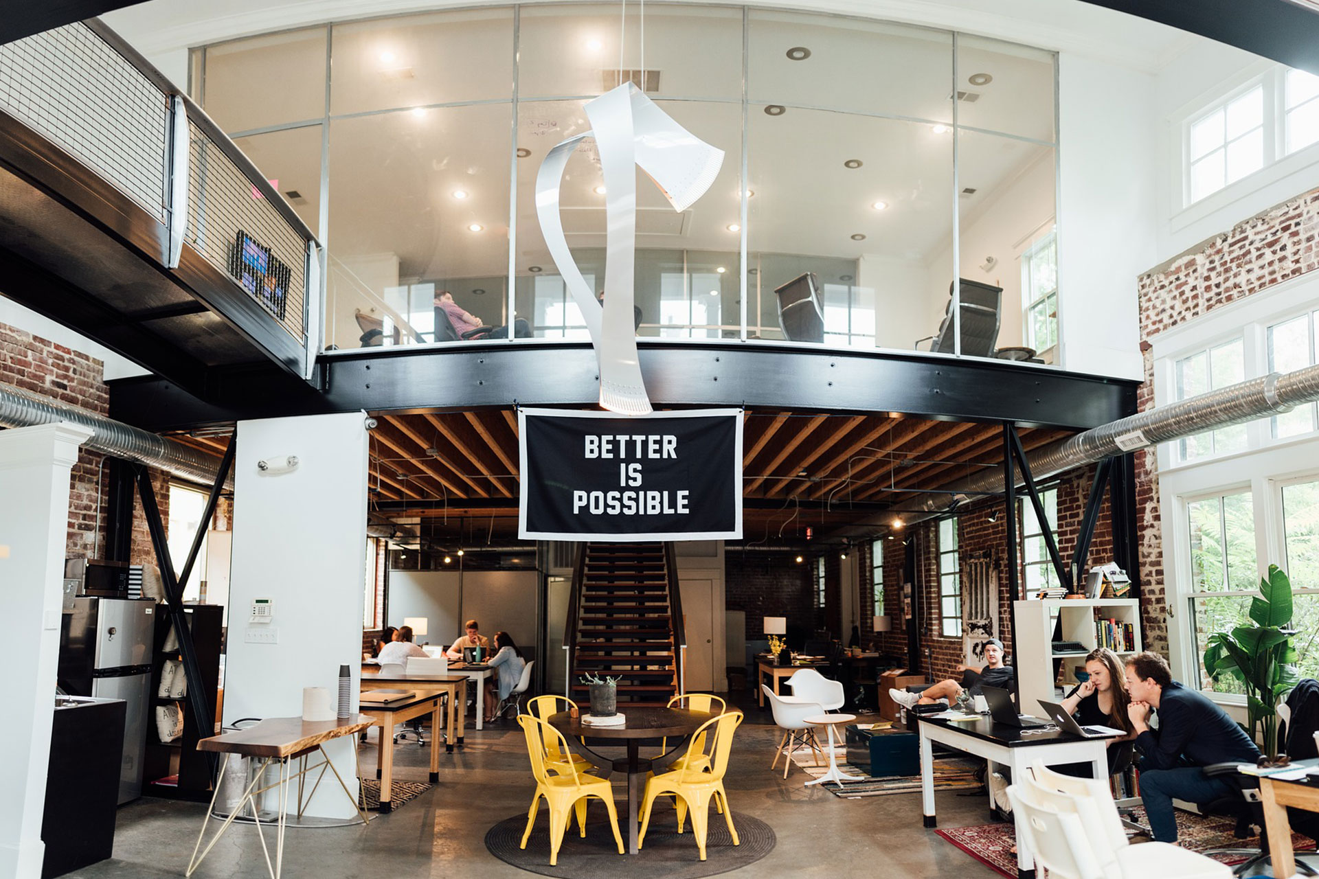 large open office with glass walls on second floor